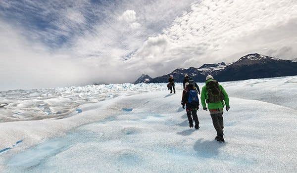 group walking around the perito moreno glacier