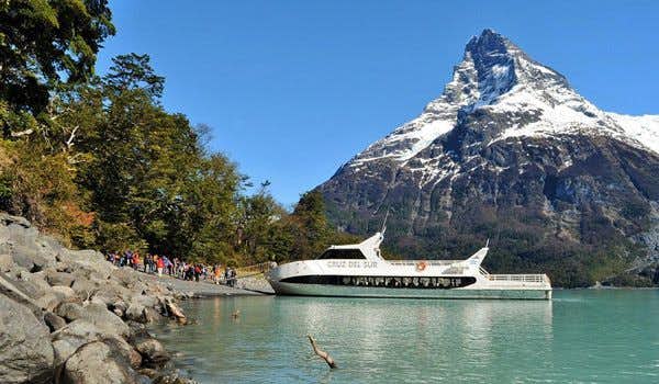 boat and travelers in Lake Argentino