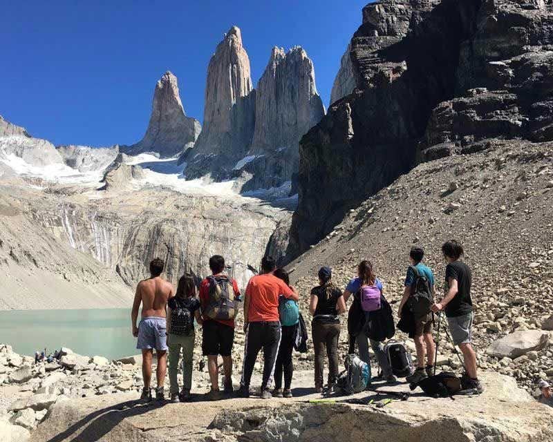 group admiring the towers at base of torres del paine