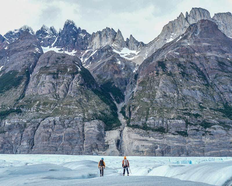 people walking through the glacier