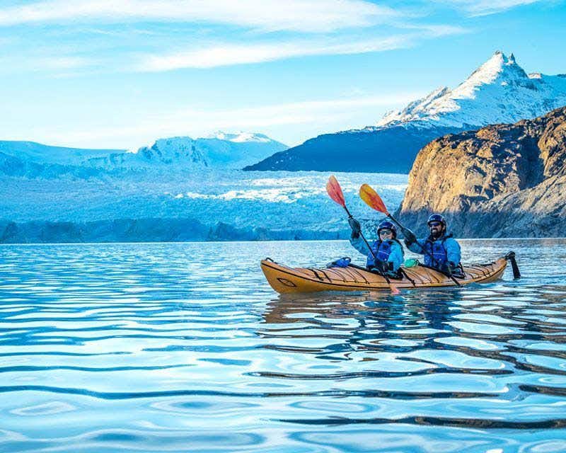 couple kayaking through the grey lake