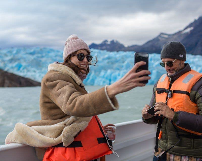 Hikers observing glacier Grey