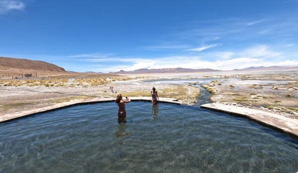 girls bathing in the polque hot springs