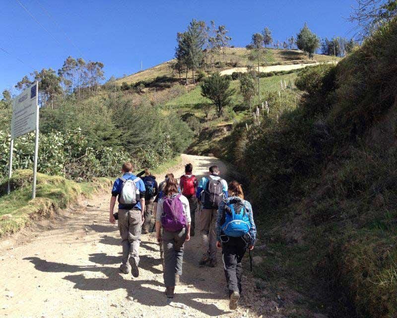 group of people trekking to the quilotoa lagoon