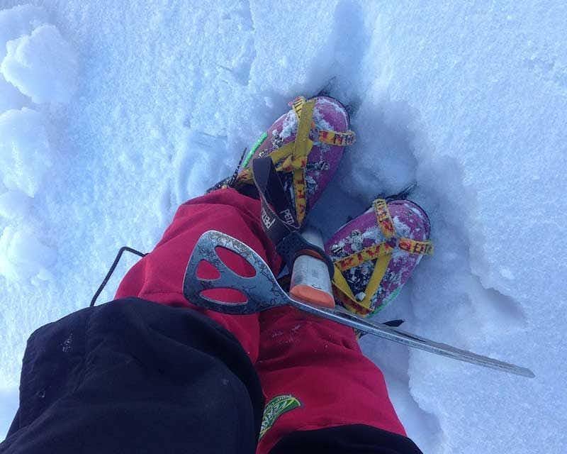 crampons and ice axe during the ascent of the carihuairazo volcano