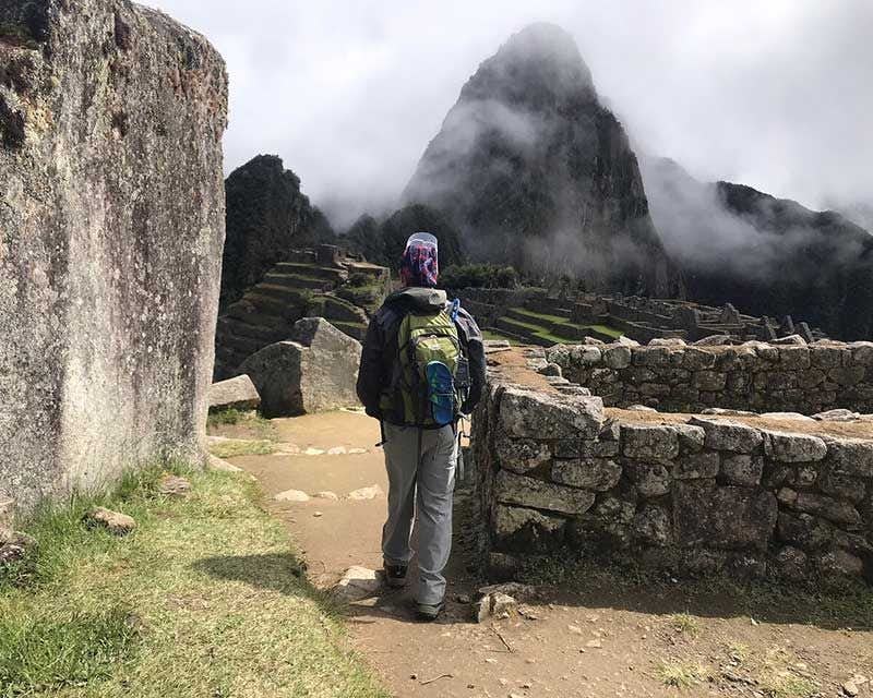 tourist visiting machu picchu following security measures covid 19