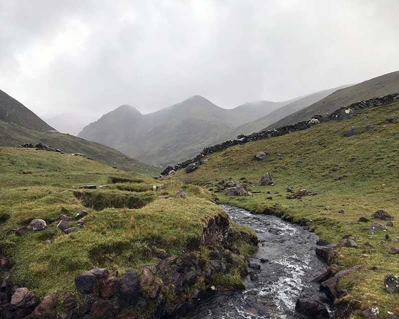 river flowing through the lares valley in peru