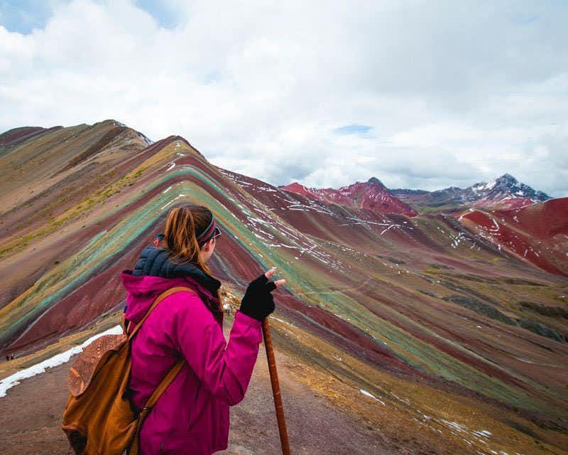 travelers in the rainbow mountain
