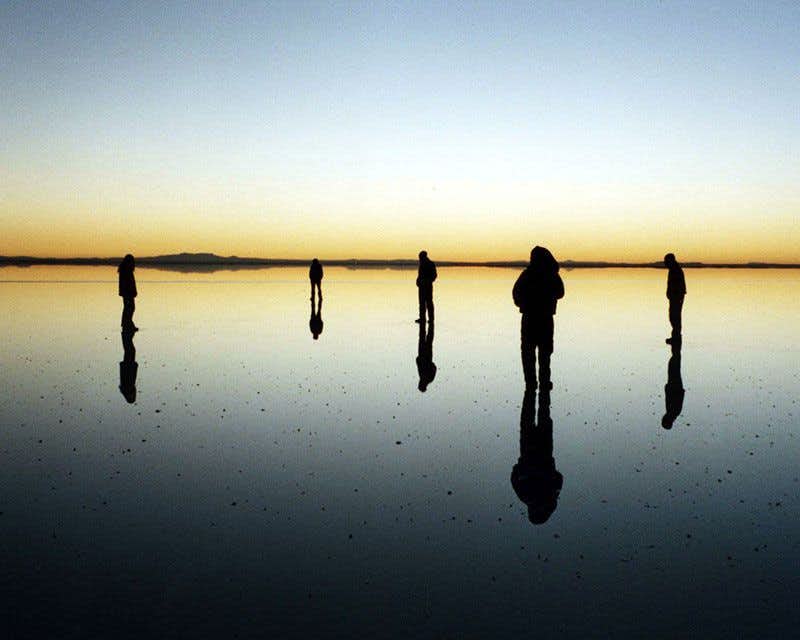 Cross the Uyuni Salt Flats in a 4x4 at sunset
