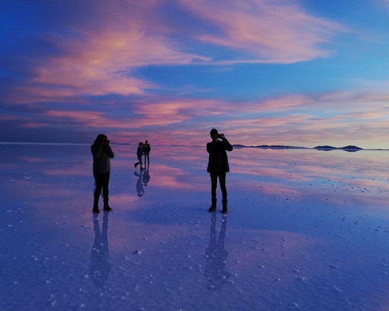 Cross the Uyuni Salt Flats in a 4x4 at sunset