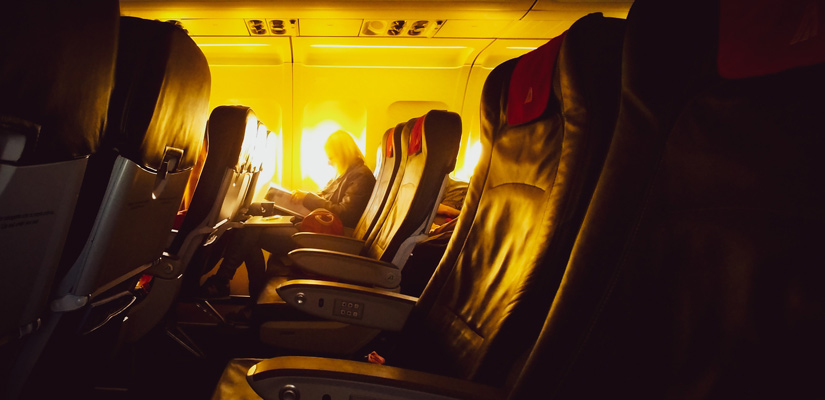 person reading on long flight