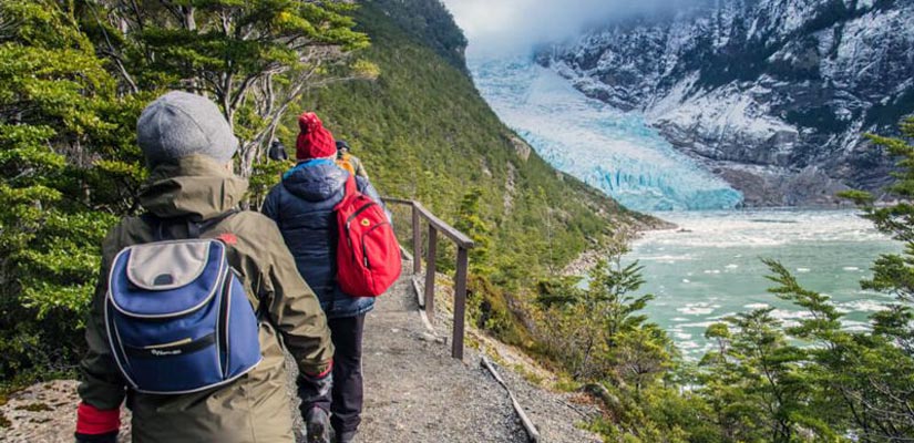 persons walking with views to glacier balmaceda and serrano