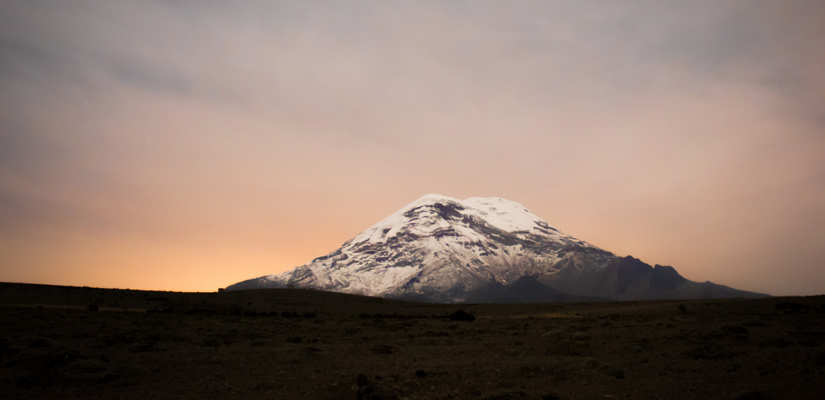 mountain chimborazo at sunset with red sky