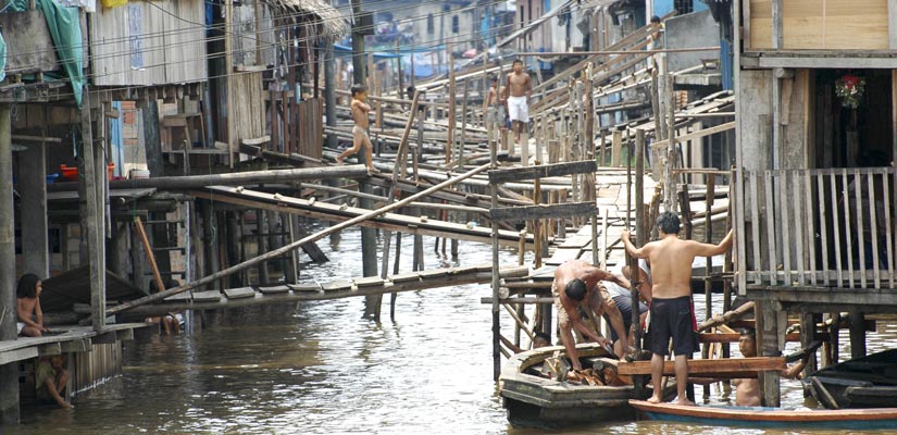 people in Iquitos on their boats