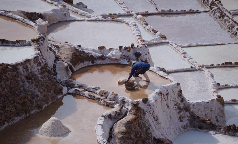 worker in Maras salt flats