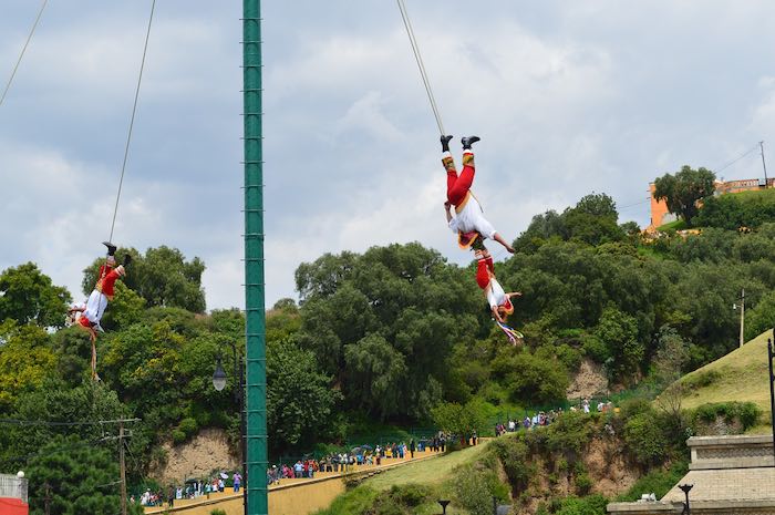 Aerial show with three Papantla flyers
