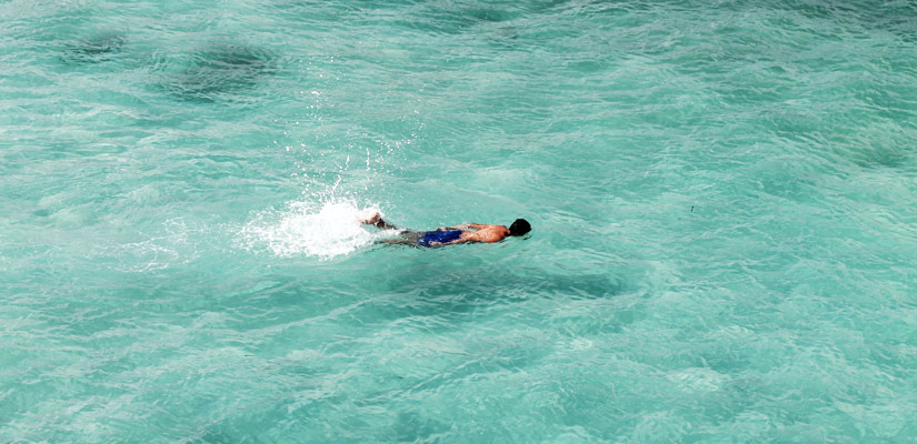 Boy diving in Galapagos Islands