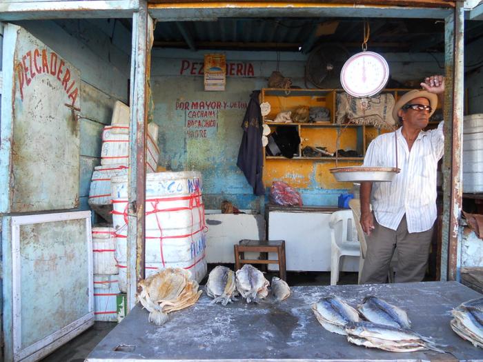 men selling fish in Santa Marta public market