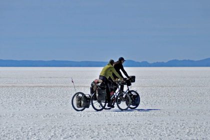 Couple with a bike in the Uyuni Salt Flats