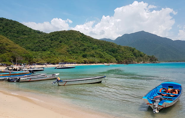 Boats on the shore of Playa Tayrona