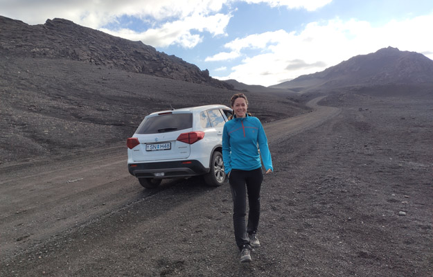 Iceland traveler with her rental car